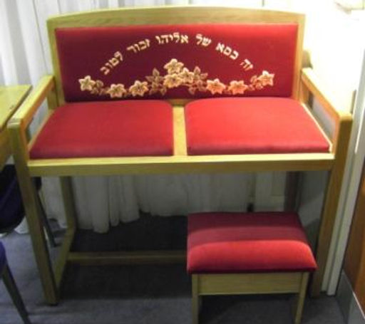 A simple chair set aside as the Throne of Elijah