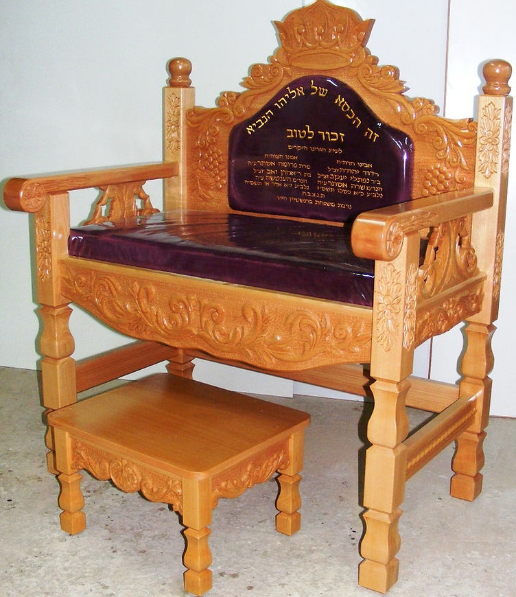 Wooden synagogue Throne of Elijah with royal-blue cushion and Hebrew inscription